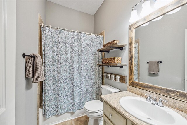 full bathroom with shower / tub combo, tile patterned floors, toilet, and vanity