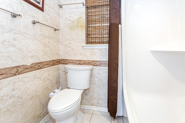 bathroom featuring tile patterned flooring and toilet