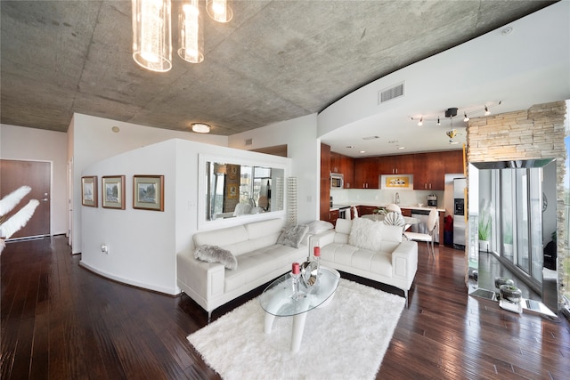 living room with dark hardwood / wood-style flooring