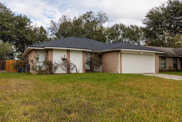 ranch-style house with central AC unit, a garage, and a front lawn