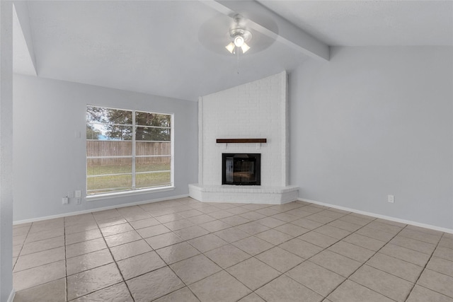 unfurnished living room featuring lofted ceiling with beams, light tile patterned flooring, a fireplace, and ceiling fan