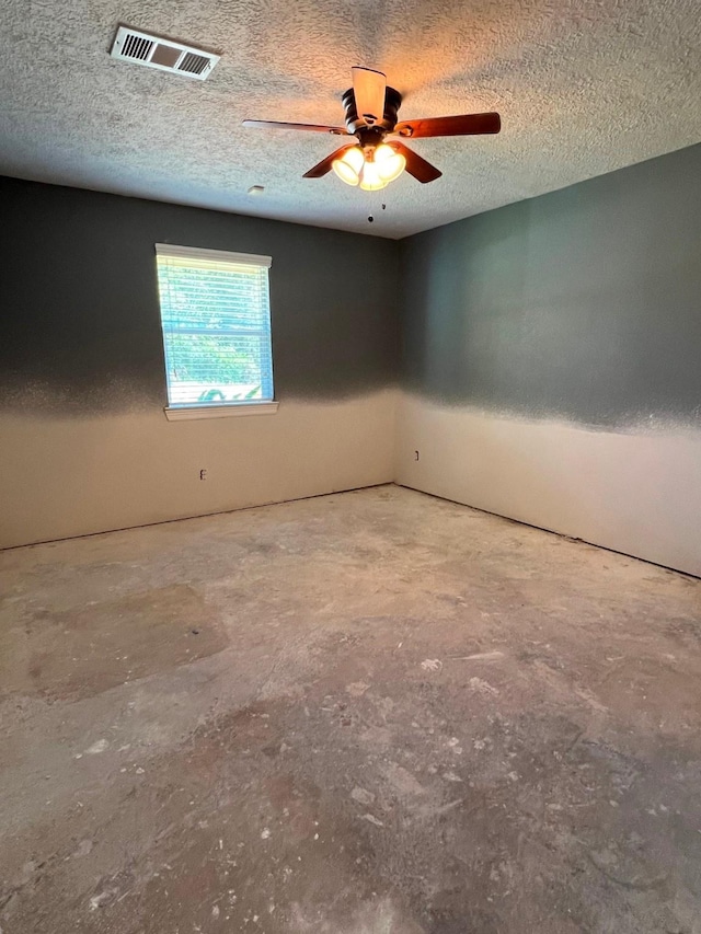 712 S Blackwell St, La Porte, TX 77571 - empty room featuring concrete floors, a textured ceiling, and ceiling fan