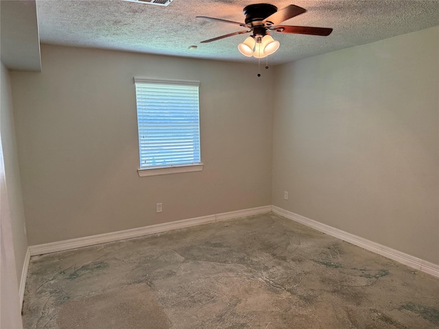 712 S Blackwell St, La Porte, TX 77571 - spare room with a textured ceiling, a ceiling fan, and baseboards