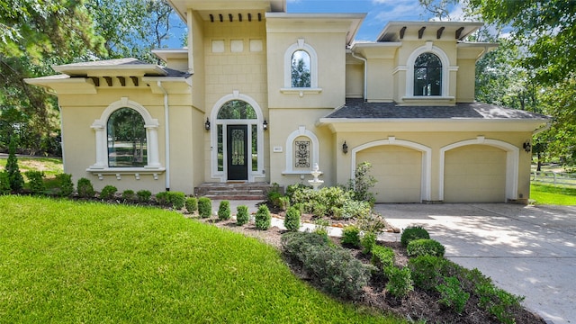 view of front of house featuring a garage and a front yard