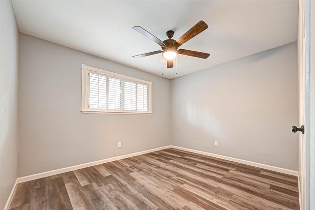 unfurnished room featuring ceiling fan and wood-type flooring