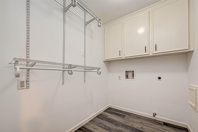 clothes washing area with baseboards, hookup for a washing machine, dark wood-style floors, cabinet space, and electric dryer hookup