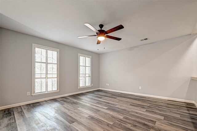 unfurnished room featuring ceiling fan and wood-type flooring