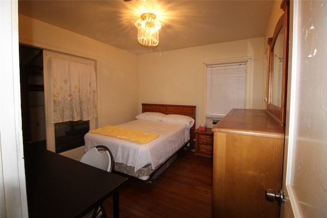 bedroom with dark wood-type flooring