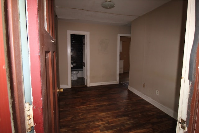 hallway featuring dark hardwood / wood-style floors