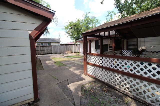 view of side of home featuring a patio