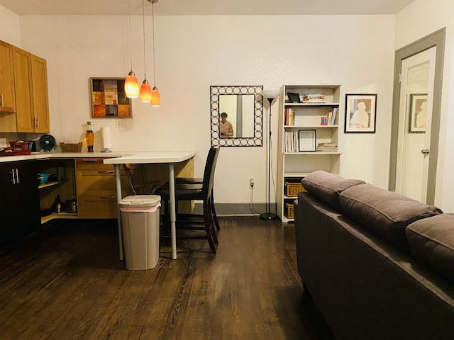 dining space with dark wood-type flooring