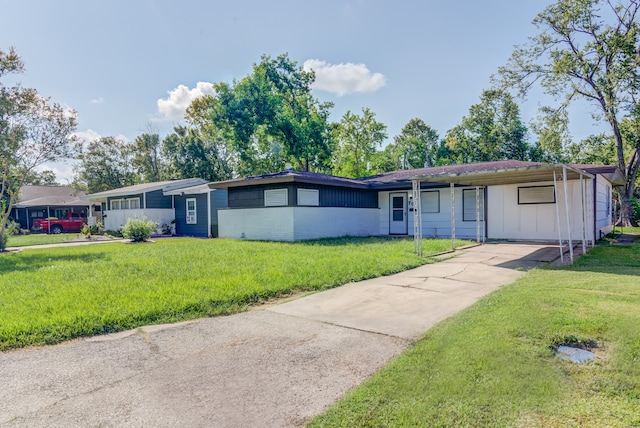 ranch-style home with a carport and a front yard