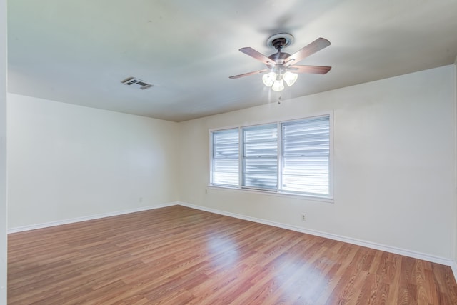 unfurnished room featuring ceiling fan and light hardwood / wood-style floors