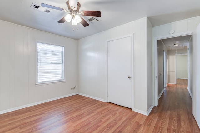 unfurnished bedroom featuring ceiling fan, a closet, and light hardwood / wood-style floors