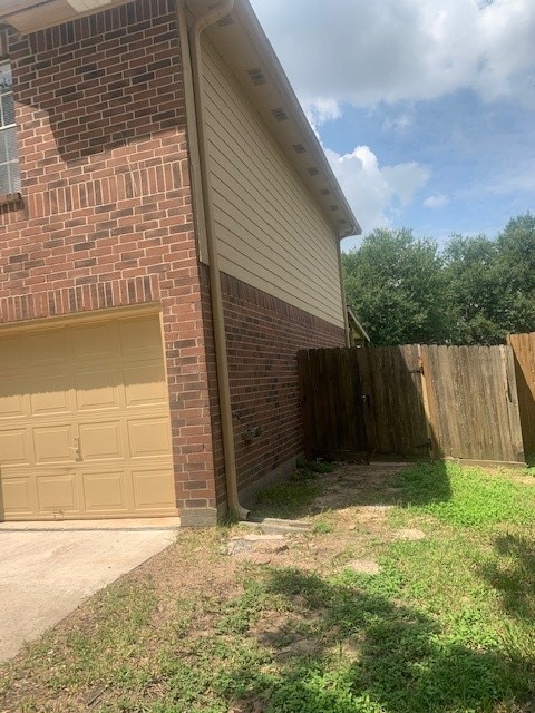 view of side of home featuring a garage