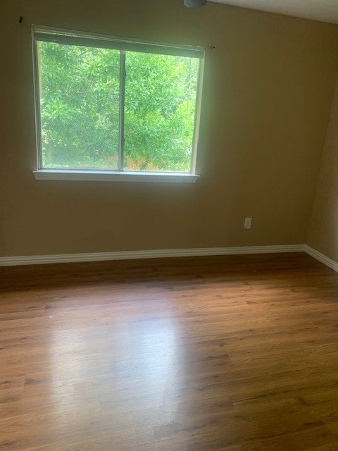 spare room featuring hardwood / wood-style floors