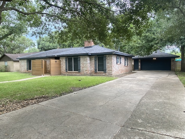 view of front facade with a garage and a front lawn