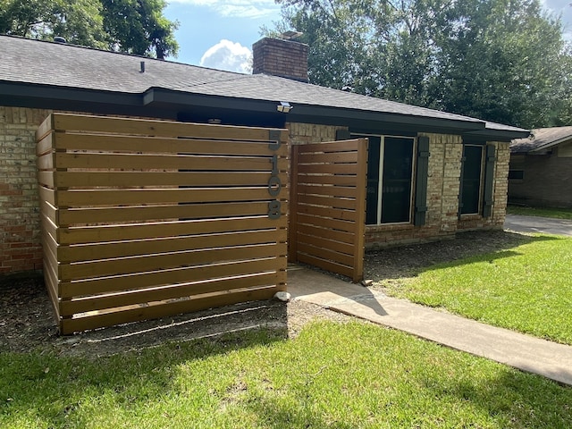 view of home's exterior with a lawn