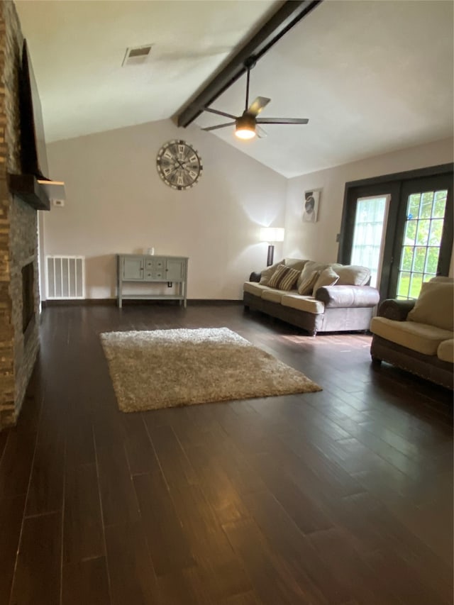 unfurnished living room with lofted ceiling with beams, ceiling fan, dark hardwood / wood-style floors, and a fireplace