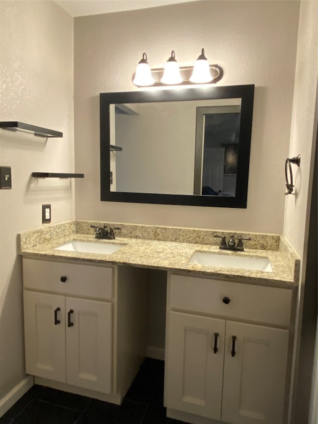 bathroom featuring tile patterned flooring and vanity