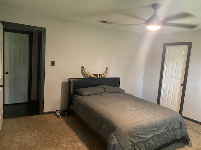 bedroom featuring ceiling fan and light carpet