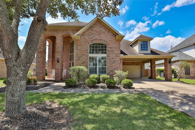 view of front of home with a garage and a front yard