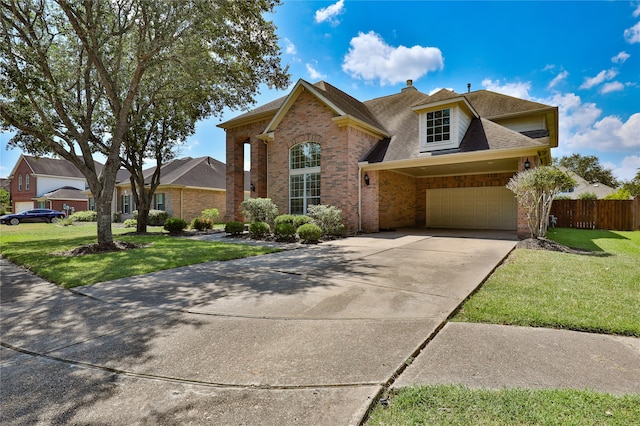 view of front of home with a garage and a front lawn