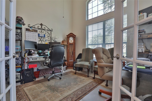 home office with a high ceiling and french doors