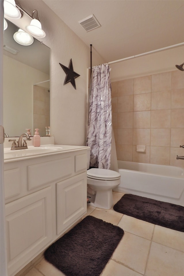 full bathroom featuring tile patterned flooring, vanity, shower / bath combo, and toilet