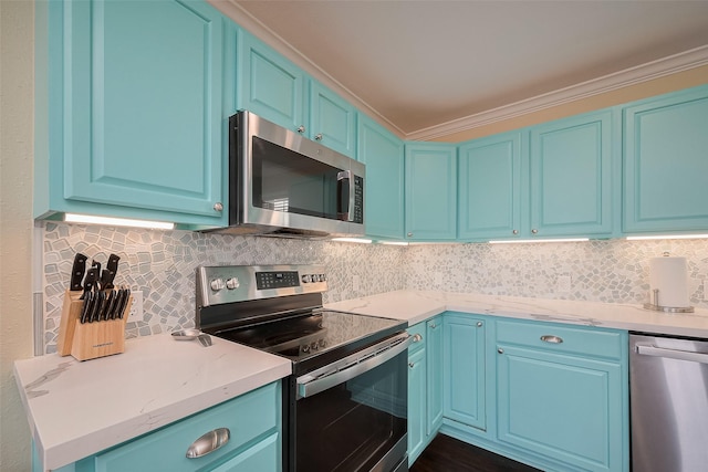 610 Surf Dr, Surfside Beach, TX 77541 - kitchen featuring blue cabinets, stainless steel appliances, backsplash, and crown molding