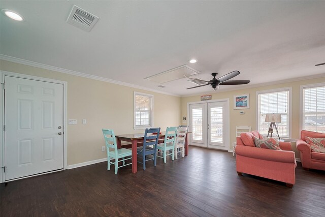 610 Surf Dr, Surfside Beach, TX 77541 - dining room with wood finished floors, attic access, ceiling fan, visible vents, and crown molding