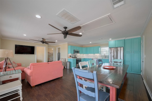 610 Surf Dr, Surfside Beach, TX 77541 - dining room featuring attic access, visible vents, ornamental molding, and dark wood-type flooring