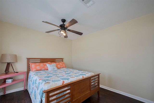 610 Surf Dr, Surfside Beach, TX 77541 - bedroom with wood finished floors, visible vents, ceiling fan, and baseboards