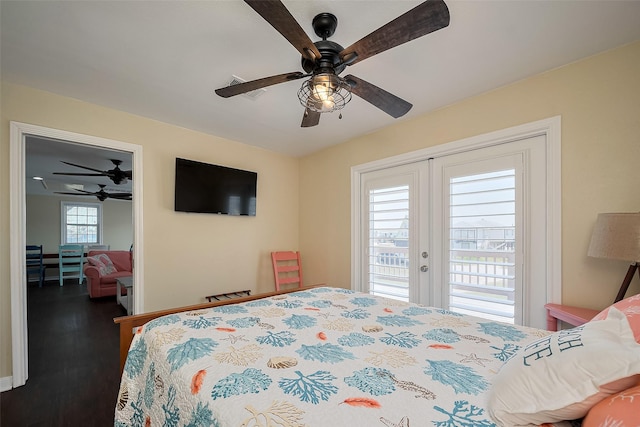 610 Surf Dr, Surfside Beach, TX 77541 - bedroom with access to exterior, a ceiling fan, and wood finished floors