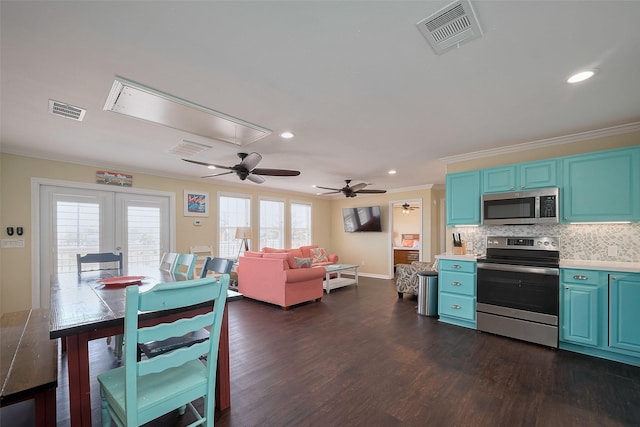 610 Surf Dr, Surfside Beach, TX 77541 - kitchen featuring blue cabinets, visible vents, ornamental molding, and appliances with stainless steel finishes