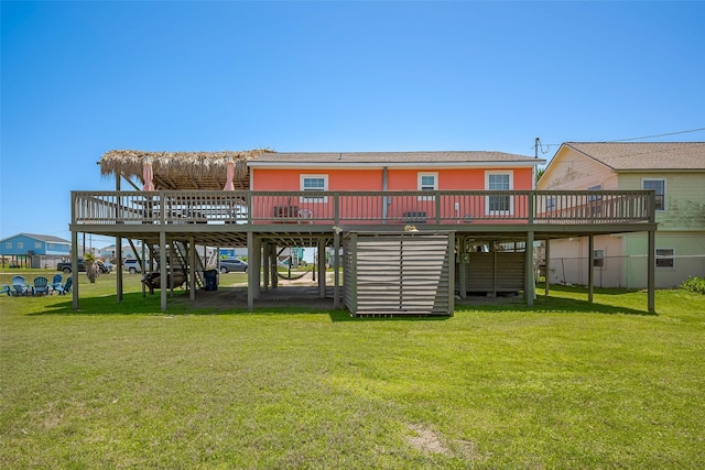 610 Surf Dr, Surfside Beach, TX 77541 - rear view of house featuring a lawn, a deck, and stairs