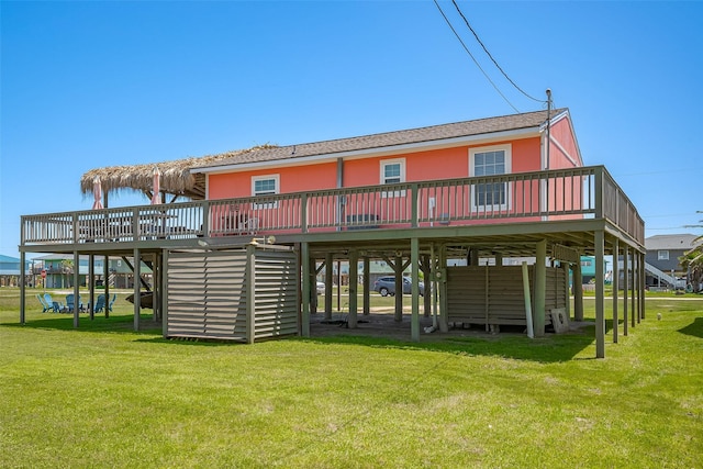 610 Surf Dr, Surfside Beach, TX 77541 - rear view of house with a wooden deck and a yard