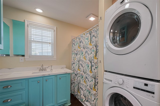 610 Surf Dr, Surfside Beach, TX 77541 - clothes washing area with stacked washing maching and dryer, laundry area, and a sink