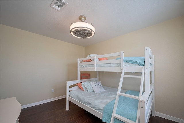 610 Surf Dr, Surfside Beach, TX 77541 - bedroom featuring baseboards, visible vents, and wood finished floors