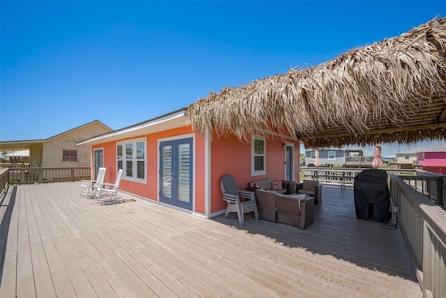 610 Surf Dr, Surfside Beach, TX 77541 - wooden terrace with outdoor lounge area