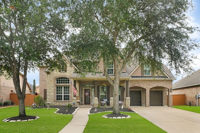 view of front facade with a garage and a front lawn