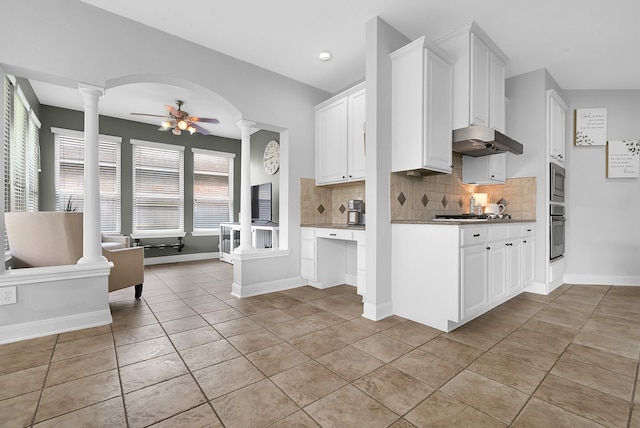 kitchen with white cabinetry, decorative backsplash, ceiling fan, stainless steel appliances, and plenty of natural light