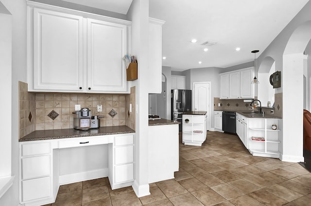 kitchen with pendant lighting, tasteful backsplash, white cabinets, dishwasher, and light tile patterned floors