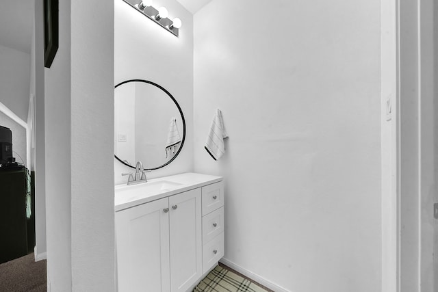 bathroom with tile patterned flooring and vanity