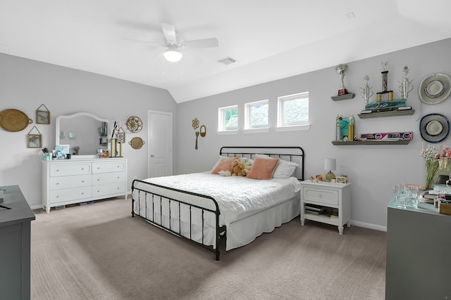 bedroom featuring ceiling fan, light carpet, and lofted ceiling