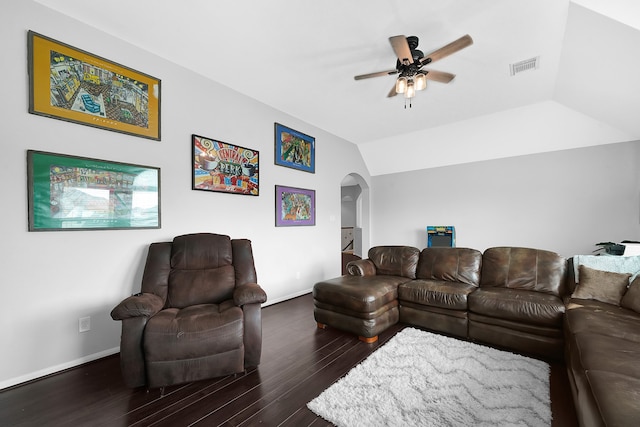 living room with ceiling fan, dark hardwood / wood-style floors, and vaulted ceiling