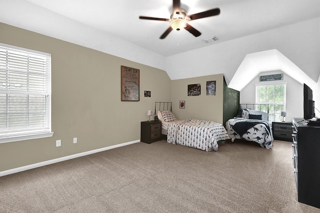 bedroom featuring ceiling fan, vaulted ceiling, and carpet floors