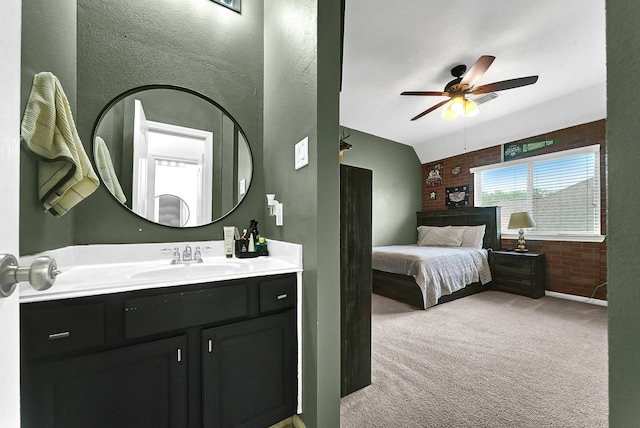 bedroom featuring sink, ceiling fan, and light colored carpet