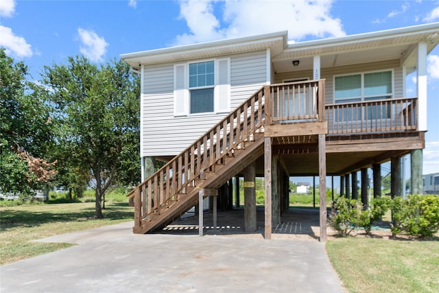 exterior space featuring a front lawn and a carport