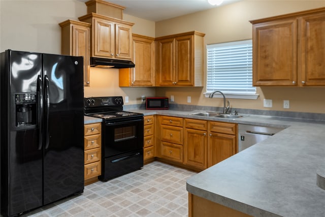 kitchen featuring sink, light tile patterned flooring, and black appliances